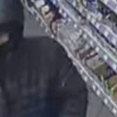 Police want to speak to this man in connection to a knife-point robbery that happened in the early hours of yesterday morning ( Friday, April 5th) at around 4-45am at Kitchens Garage in Trafalgar Street, Burnley.