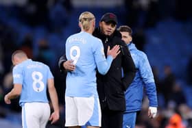 MANCHESTER, ENGLAND - JANUARY 31: Erling Haaland of Manchester City and Vincent Kompany, Manager of Burnley, embrace after the Premier League match between Manchester City and Burnley FC at Etihad Stadium on January 31, 2024 in Manchester, England. (Photo by Alex Livesey/Getty Images)