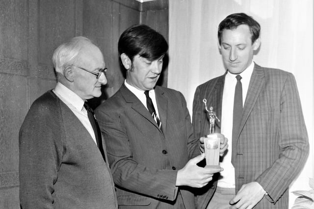 The Burnley Express Sportsman of the Year trophy was to be presented to the winner by Burnley Football Club Chairman Mr Bob Lord at Turf Moor on Tuesday, September 28th, 1971 when the Clarets were at home to Orient in a Second Division match. Our picture shows the trophy being admired by the editor of the Burnley Express, Mr Keith Hall, with sports editor Keith McNee (right) and chief sports writer Don Smith.
