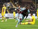 BURNLEY, ENGLAND - NOVEMBER 20: Maxwel Cornet of Burnley celebrates after scoring their team's third goal during the Premier League match between Burnley and Crystal Palace at Turf Moor on November 20, 2021 in Burnley, England. (Photo by Jan Kruger/Getty Images)