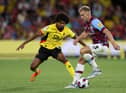 WATFORD, ENGLAND - AUGUST 12: Hamza Choudhury of Watford challenges Charlie Taylor of Burnley during the Sky Bet Championship between Watford and Burnley at Vicarage Road on August 12, 2022 in Watford, England. (Photo by Richard Heathcote/Getty Images)