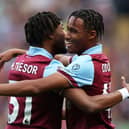 BURNLEY, ENGLAND - OCTOBER 07: Wilson Odobert of Burnley celebrates with Mike Tresor Ndayishimiye after scoring the teams first goal during the Premier League match between Burnley FC and Chelsea FC at Turf Moor on October 07, 2023 in Burnley, England. (Photo by Matt McNulty/Getty Images)