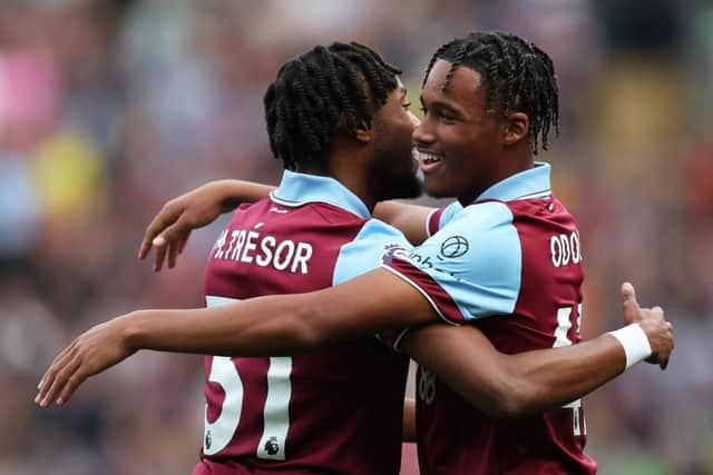 BURNLEY, ENGLAND - OCTOBER 07: Wilson Odobert of Burnley celebrates with Mike Tresor Ndayishimiye after scoring the teams first goal during the Premier League match between Burnley FC and Chelsea FC at Turf Moor on October 07, 2023 in Burnley, England. (Photo by Matt McNulty/Getty Images)