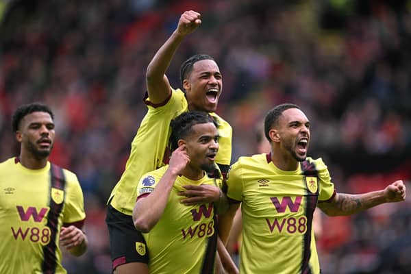 SHEFFIELD, ENGLAND - APRIL 20: Burnley players left to right Lyle Foster, Wilson Odobert, Lorenz Assignon and Vitinho (r) celebrate the third Burnely goal during the Premier League match between Sheffield United and Burnley FC at Bramall Lane on April 20, 2024 in Sheffield, England. (Photo by Stu Forster/Getty Images)