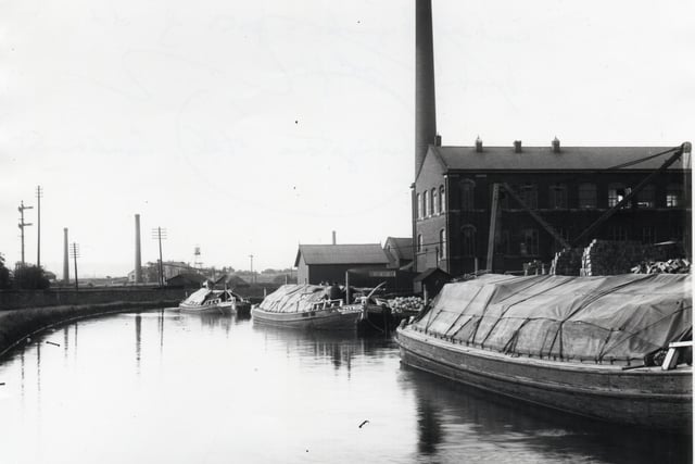 Another image showing Livingstone Mill with a number of broad barges which were used on the Leeds and Liverpool Canal.