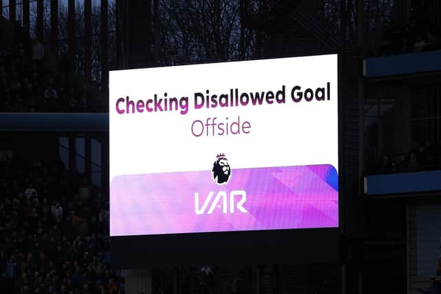 BIRMINGHAM, ENGLAND - DECEMBER 30: A general view of the scoreboard as the VAR review a goal scored by Lyle Foster of Burnley (not pictured) which is disallowed for offside during the Premier League match between Aston Villa and Burnley FC at Villa Park on December 30, 2023 in Birmingham, England. (Photo by Richard Heathcote/Getty Images)