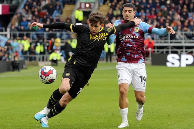 Wigan Athletic's Callum Lang holds off the challenge from Burnley's Anass Zaroury

The EFL Sky Bet Championship - Burnley v Wigan Athletic - Saturday 11th March 2023 - Turf Moor - Burnley