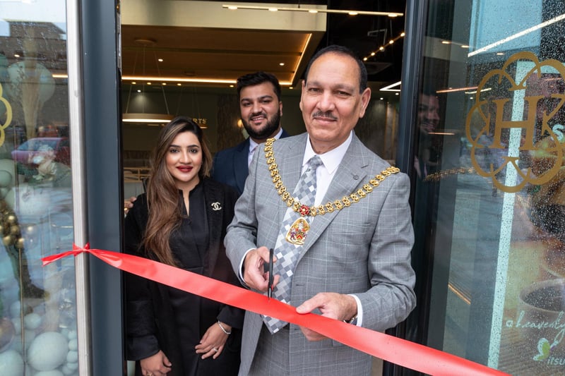 The Mayor of Burnley Coun. Raja Arif Khan officially opens Heavenly Desserts at Pioneer Place in Burnley with co-owners Sannah and Daoud. Photo: Kelvin Lister-Stuttard