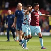 WATFORD, ENGLAND - APRIL 30: Aaron Lennon and Jack Cork of Burnley celebrate after their sides victory during the Premier League match between Watford and Burnley at Vicarage Road on April 30, 2022 in Watford, England. (Photo by Julian Finney/Getty Images)
