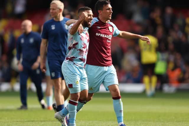 WATFORD, ENGLAND - APRIL 30: Aaron Lennon and Jack Cork of Burnley celebrate after their sides victory during the Premier League match between Watford and Burnley at Vicarage Road on April 30, 2022 in Watford, England. (Photo by Julian Finney/Getty Images)