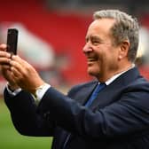 BRISTOL, ENGLAND - JUNE 20: Presenter Jeff Stelling interacts with their mobile phone following the Vanarama National League Play-Off Final match between Hartlepool United and Torquay United at Ashton Gate on June 20, 2021 in Bristol, England. (Photo by Harry Trump/Getty Images)