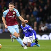 BURNLEY, ENGLAND - MARCH 01:  James Tarkowski of Burnley during the Premier League match between Burnley and Leicester City at Turf Moor on March 01, 2022 in Burnley, England.