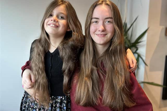 Sisters Amelia (nine) and Elena (15) are having their hair cut for charity.