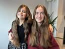 Sisters Amelia (nine) and Elena (15) are having their hair cut for charity.