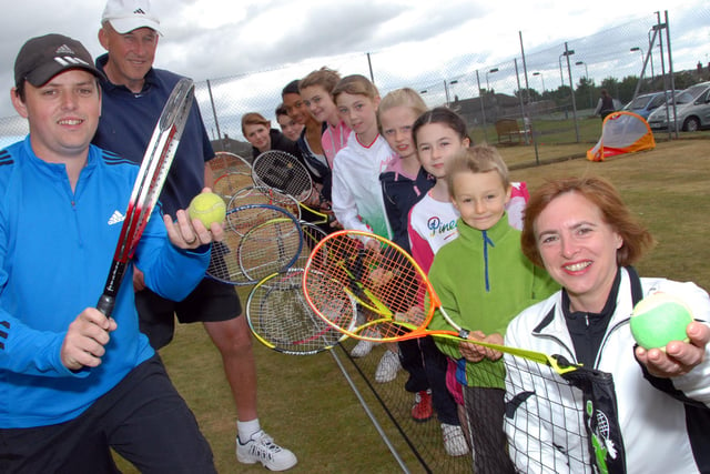 Coaches Stephen Attewell and Mike Collins, left, were joined by Club Chairman Sharon Cox-Smith, right and local youngsters at an Open Day in 2011.