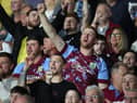 HUDDERSFIELD, ENGLAND - JULY 29: A Burnley supporter cheers during the Sky Bet Championship match between Huddersfield Town and Burnley at John Smith's Stadium on July 29, 2022 in Huddersfield, England. (Photo by Ashley Allen/Getty Images)