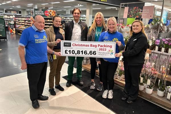 Pendleside volunteer and ambassador Keith Jackson, M&S staff Sonny and Ruth, hospice fundraisers Sarah Holdsworth and Leah Hooper, and M&;S food manager Rebecca Gregory at the cheque presentation.