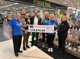 Pendleside volunteer and ambassador Keith Jackson, M&S staff Sonny and Ruth, hospice fundraisers Sarah Holdsworth and Leah Hooper, and M&;S food manager Rebecca Gregory at the cheque presentation.