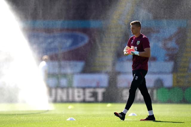 BURNLEY, ENGLAND - JUNE 25: Lukas Jensen of Burnley warms up prior to the Premier League match between Burnley FC and Watford FC at Turf Moor on June 25, 2020 in Burnley, United Kingdom. (Photo by Jon Super/Pool via Getty Images)