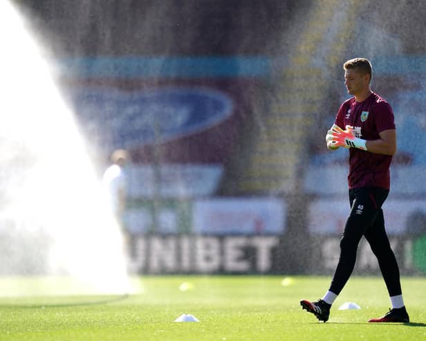 BURNLEY, ENGLAND - JUNE 25: Lukas Jensen of Burnley warms up prior to the Premier League match between Burnley FC and Watford FC at Turf Moor on June 25, 2020 in Burnley, United Kingdom. (Photo by Jon Super/Pool via Getty Images)
