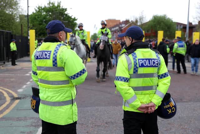 MANCHESTER, ENGLAND - APRIL 28: Police are seen outside the stadium prior to the Premier League match between Manchester United and Chelsea at Old Trafford on April 28, 2022 in Manchester, England. (Photo by Alex Livesey/Getty Images)