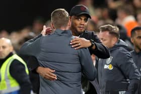 LUTON, ENGLAND - OCTOBER 03: Vincent Kompany, Manager of Burnley, embraces Rob Edwards, Manager of Luton Town, following the the Premier League match between Luton Town and Burnley FC at Kenilworth Road on October 03, 2023 in Luton, England. (Photo by Warren Little/Getty Images)
