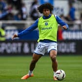 Auxerre's French midfielder Han-Noah Massengo warms up with his teammates prior to the French L1 football match between AJ Auxerre (AJA) and Troyes ESTAC at Stade de lAbbe-Deschamps in Auxerre, central France, on April 1, 2023. (Photo by ARNAUD FINISTRE / AFP) (Photo by ARNAUD FINISTRE/AFP via Getty Images)