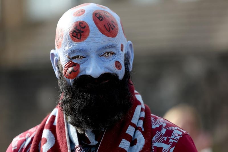 BURNLEY, ENGLAND - OCTOBER 07: A Burnley fan poses for a photo prior to the Premier League match between Burnley FC and Chelsea FC at Turf Moor on October 07, 2023 in Burnley, England. (Photo by Matt McNulty/Getty Images)
