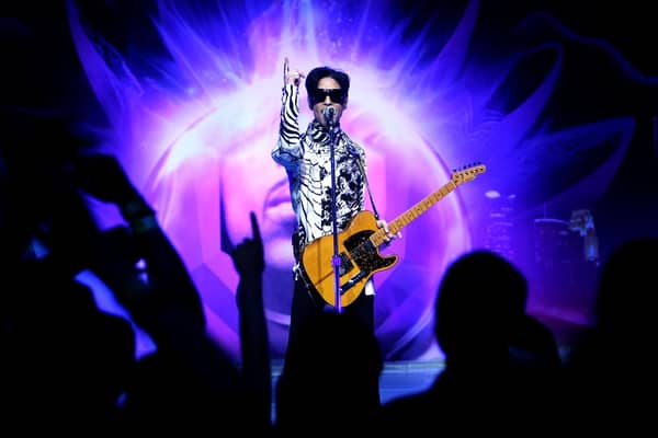 Musician Prince performs his first of three shows onstage during One Night... Three Venues hosted by Prince and Lotusflow3r.com held at NOKIA Theatre L.A. LIVE on March 28, 2009 in Los Angeles, California. (Photo by Kristian Dowling/Getty Images for Lotusflow3r.com)