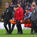 BURNLEY, ENGLAND - FEBRUARY 17: Aaron Ramsey of Burnley receives oxygen whilst being stretchered off the field by medical staff during the Premier League match between Burnley FC and Arsenal FC at Turf Moor on February 17, 2024 in Burnley, England. (Photo by Matt McNulty/Getty Images)