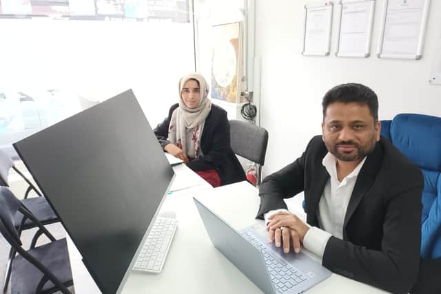 Samina Kousar, support worker, and programme director Ibrar Syed hard at work at the eHabits head office in Burnley