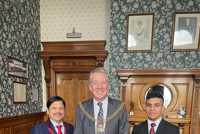 Aroma restaurateur Abdul Majeed (left) receiving his award at Burnley Town Hall from Burnley Mayor, Coun. Mark Townsend