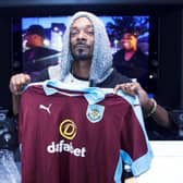 Snoop Dogg with the Burnley FC top gifted to him