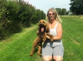 Sarah Seed, pictured with her son's dog Charlie, at Kitty Catz Cattery and Kennels, which she is fighting to save after it was slapped with a Noise Abatement notice