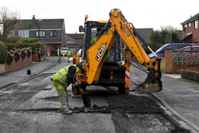 Road repair work in Lancashire takes a variety of forms - from relaying entire roads to patching clusters of potholes (image: Neil Cross)