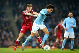 MANCHESTER, ENGLAND - JANUARY 09:  Leroy Sane of Manchester City and Josh Brownhill of Bristol City in action during the Carabao Cup Semi-Final First Leg match between Manchester City and Bristol City at Etihad Stadium on January 9, 2018 in Manchester, England.  (Photo by Alex Livesey/Getty Images)