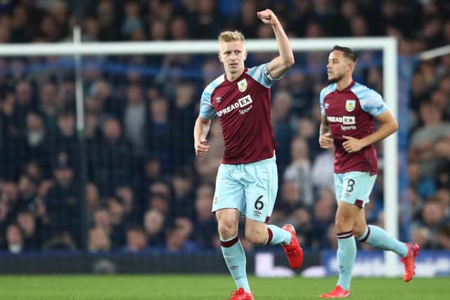 LIVERPOOL, ENGLAND - SEPTEMBER 13: Ben Mee of Burnley  celebrates after scoring their team's first goal during the Premier League match between Everton and Burnley at Goodison Park on September 13, 2021 in Liverpool, England. (Photo by Jan Kruger/Getty Images)