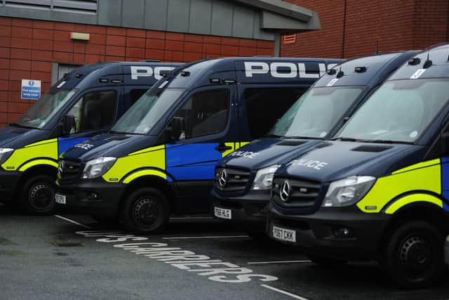 Eight people were arrested and £20,000 seized in a series of coordinated raids in East Lancashire