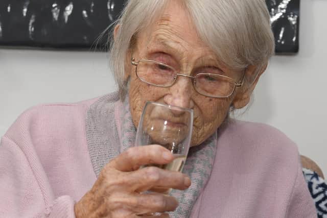 Jean Garstang celebrates  turning 108 with fish and chips and a glass of bubbly