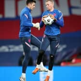 LONDON, ENGLAND - OCTOBER 14: Nick Pope of England and Jordan Pickford of England warm up ahead of the UEFA Nations League group stage match between England and Denmark at Wembley Stadium on October 14, 2020 in London, England. Football Stadiums around Europe remain empty due to the Coronavirus Pandemic as Government social distancing laws prohibit fans inside venues resulting in fixtures being played behind closed doors. (Photo by Nick Potts - Pool/Getty Images)
