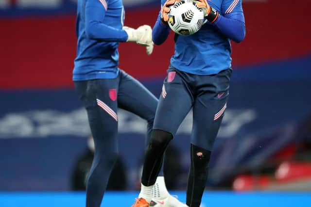 LONDON, ENGLAND - OCTOBER 14: Nick Pope of England and Jordan Pickford of England warm up ahead of the UEFA Nations League group stage match between England and Denmark at Wembley Stadium on October 14, 2020 in London, England. Football Stadiums around Europe remain empty due to the Coronavirus Pandemic as Government social distancing laws prohibit fans inside venues resulting in fixtures being played behind closed doors. (Photo by Nick Potts - Pool/Getty Images)