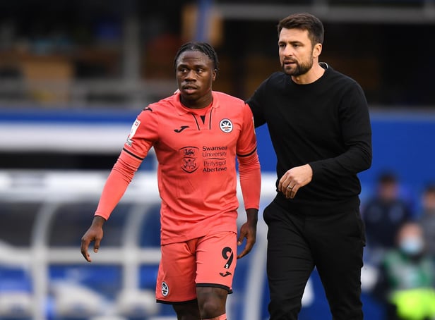 BIRMINGHAM, ENGLAND - OCTOBER 23: Swansea City Head Coach Russell Martin hugs Michael Obafemi after the final whistle during the Sky Bet Championship match between Birmingham City and Swansea City at St Andrew's Trillion Trophy Stadium on October 23, 2021 in Birmingham, England. (Photo by Tony Marshall/Getty Images)