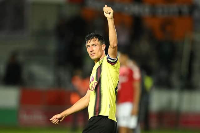 SALFORD, ENGLAND - SEPTEMBER 26: Jack Cork of Burnley gestures a thumbs-up to the fans at full-time following the Carabao Cup Third Round match between Salford City and Burnley at Peninsula Stadium on September 26, 2023 in Salford, England. (Photo by Michael Regan/Getty Images)