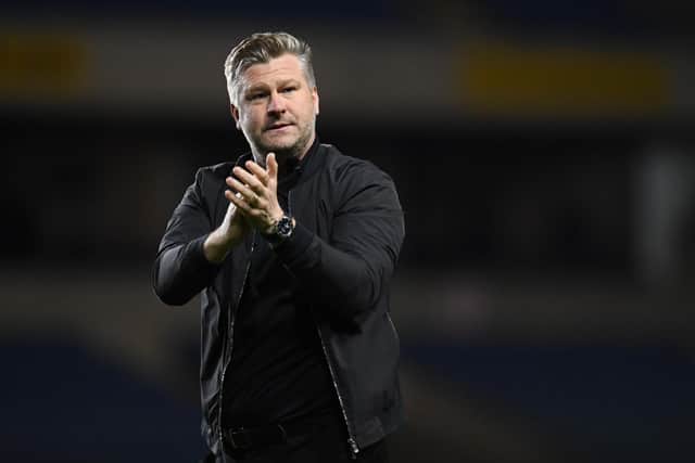 OXFORD, ENGLAND - APRIL 19: Karl Robinson, Manager of Oxford United, applauds their fans after the final whistle of the Sky Bet League One match between Oxford United and Milton Keynes Dons at Kassam Stadium on April 19, 2022 in Oxford, England. (Photo by Alex Burstow/Getty Images)
