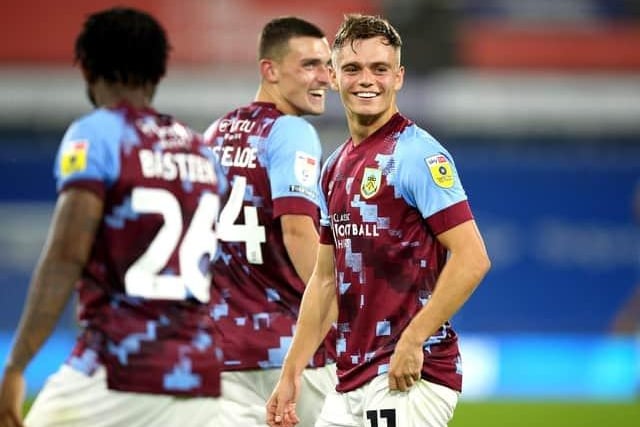 Burnley's Scott Twine (right) and team-mates celebrate victory after the final whistle during the Sky Bet Championship match at the John Smith's Stadium, Huddersfield. Picture date: Friday July 29, 2022.