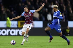 BURNLEY, ENGLAND - DECEMBER 27: Jack Cork of Burnley makes a pass whilst under pressure from Juninho Bacuna of Birmingham City during the Sky Bet Championship between Burnley and Birmingham City at Turf Moor on December 27, 2022 in Burnley, England. (Photo by Cameron Smith/Getty Images)