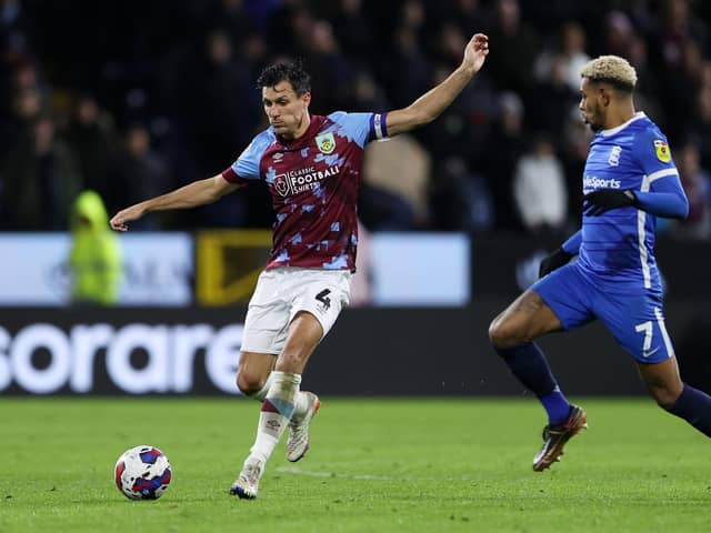BURNLEY, ENGLAND - DECEMBER 27: Jack Cork of Burnley makes a pass whilst under pressure from Juninho Bacuna of Birmingham City during the Sky Bet Championship between Burnley and Birmingham City at Turf Moor on December 27, 2022 in Burnley, England. (Photo by Cameron Smith/Getty Images)