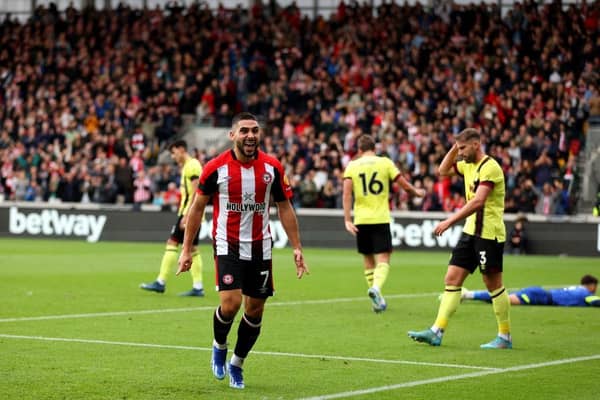 BRENTFORD, ENGLAND - OCTOBER 21: Neal Maupay of Brentford celebrates as Yoane Wissa of Brentford (not pictured) scores the team's first goal during the Premier League match between Brentford FC and Burnley FC at Gtech Community Stadium on October 21, 2023 in Brentford, England. (Photo by Luke Walker/Getty Images)