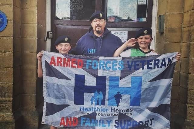 Army veteran Mark Harrison with his two youngest sons Freddie and Finley. The trio are heading to Tel Aviv next weekend for the annual Veterans' Games and Conference event