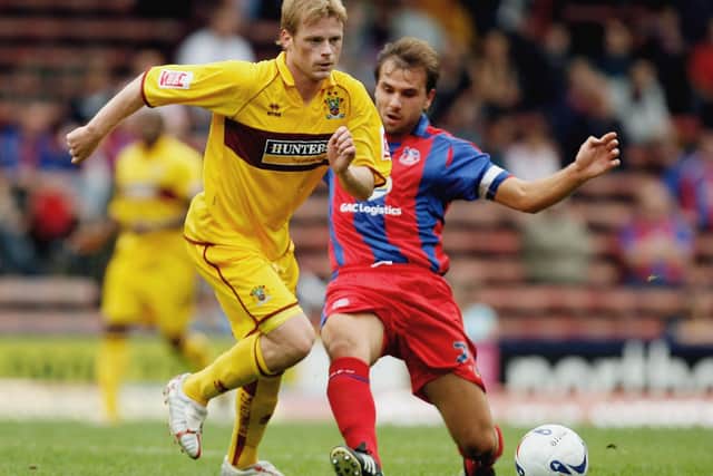 LONDON - AUGUST 26:  Carl Fletcher of Crystal Palace tries to tackle Alan Mahon of Burnley during the Coca-Cola Championship match between Crystal Palace and Burnley at Selhurst Park on August 13, 2006 in London, England.  (Photo by Ian Walton/Getty Images)